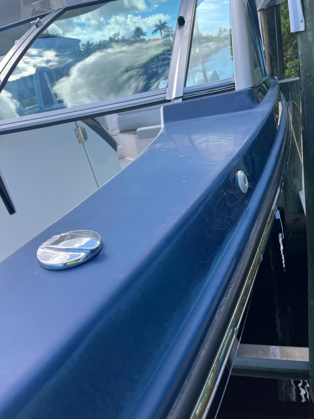 Before — dull blue hull side